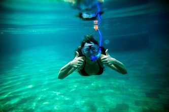 woman snorkel underwater